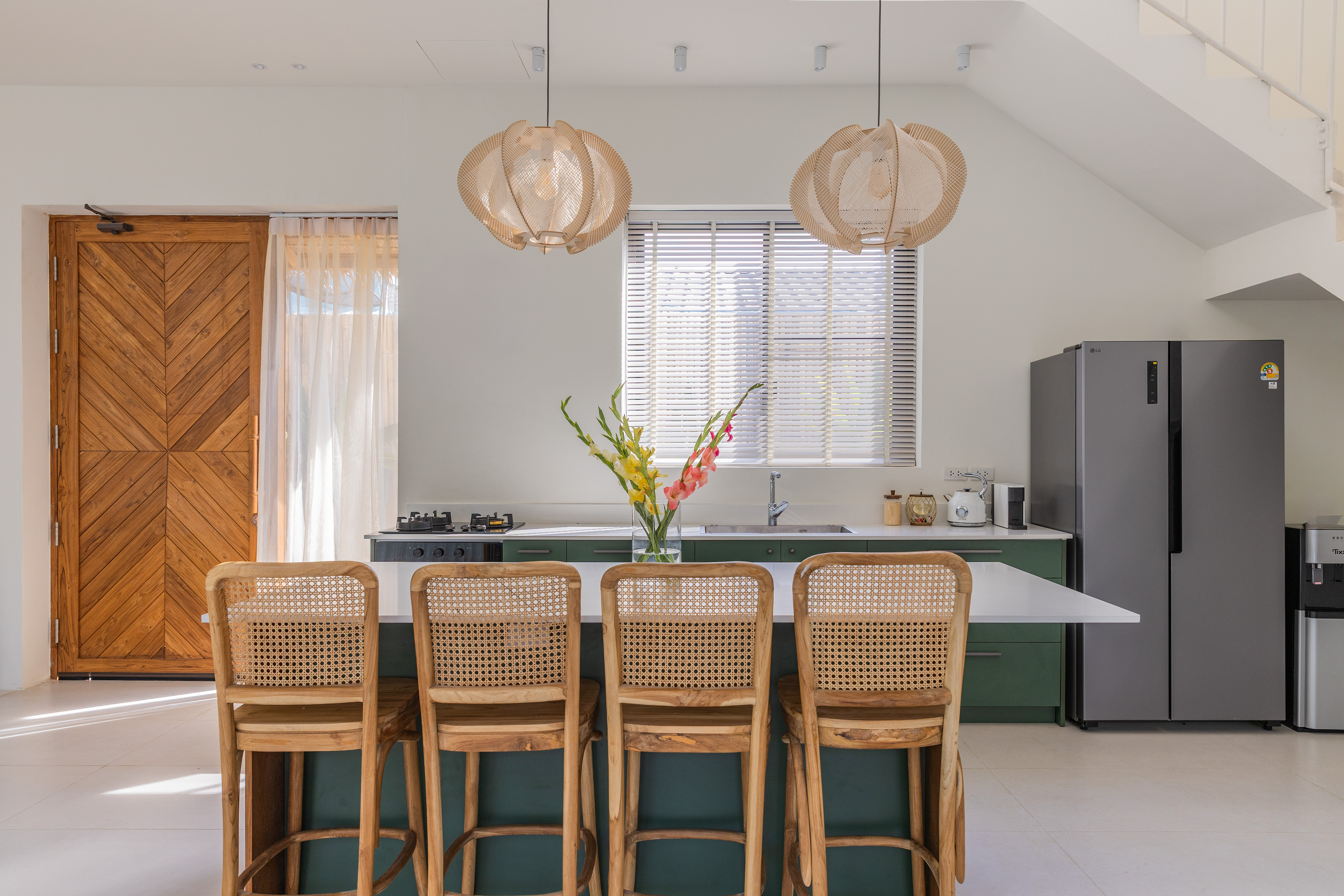 Kitchen with rattan bar chairs