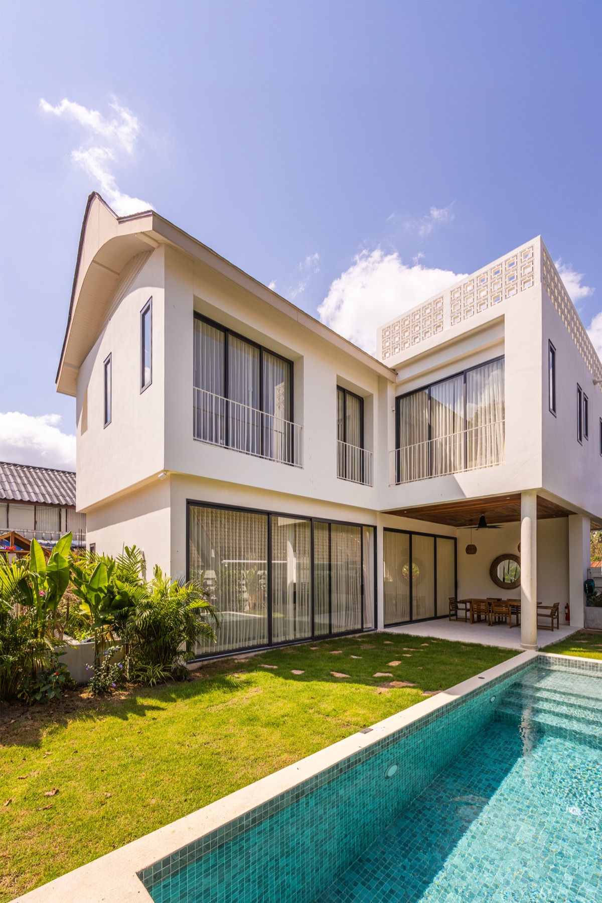 Orchid Chaloklam Villa exterior with pool